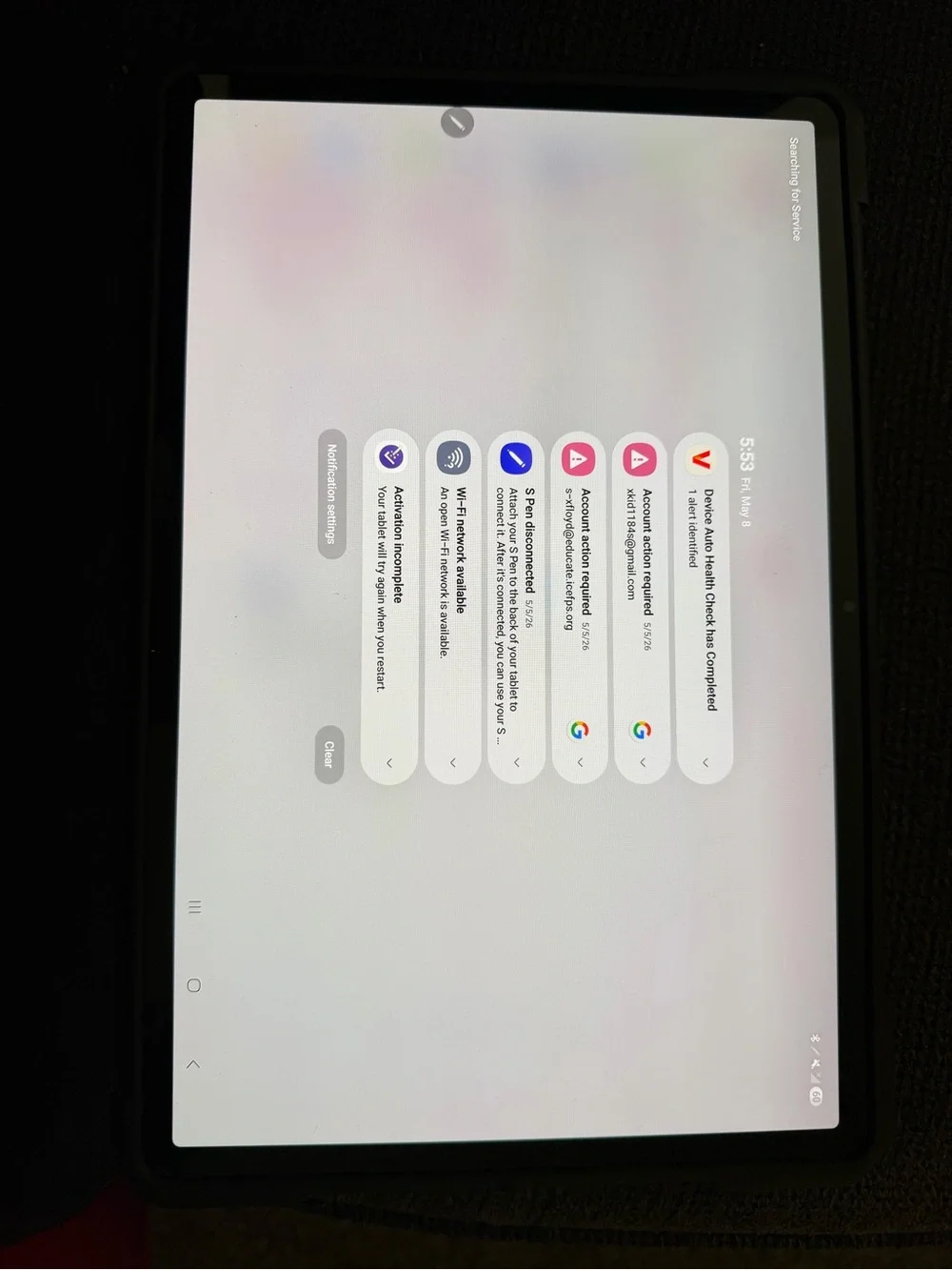 Samsung Tablet with Black Case and Green Wallpaper Display